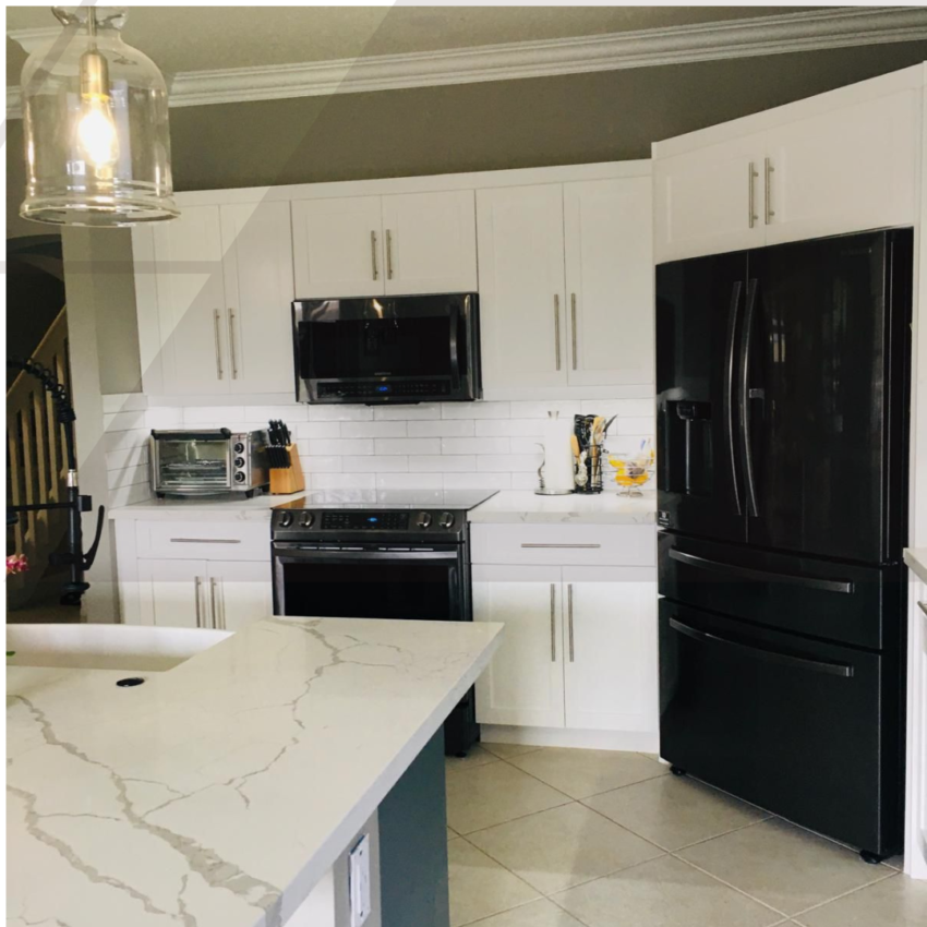 Modern kitchen remodel featuring white shaker cabinets, veined quartz countertops, white subway tile backsplash, and black stainless steel appliances by MR Designer Services.